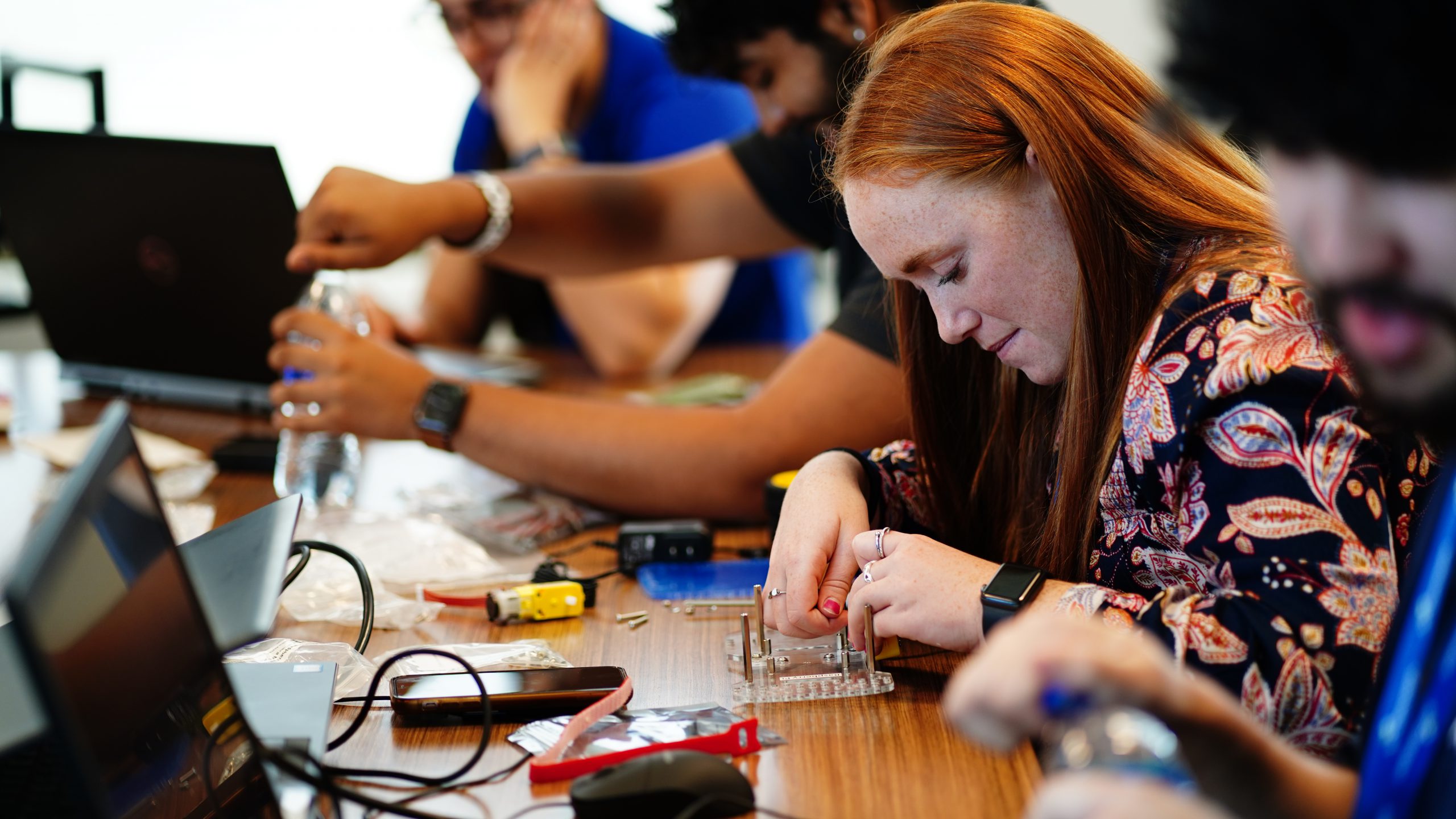Interns learning about robotics at our Hackathon